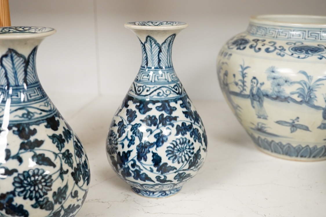 A pair of Chinese blue and white pear shaped vases, a similar jar and a Japanese bowl, largest 23cm in diameter